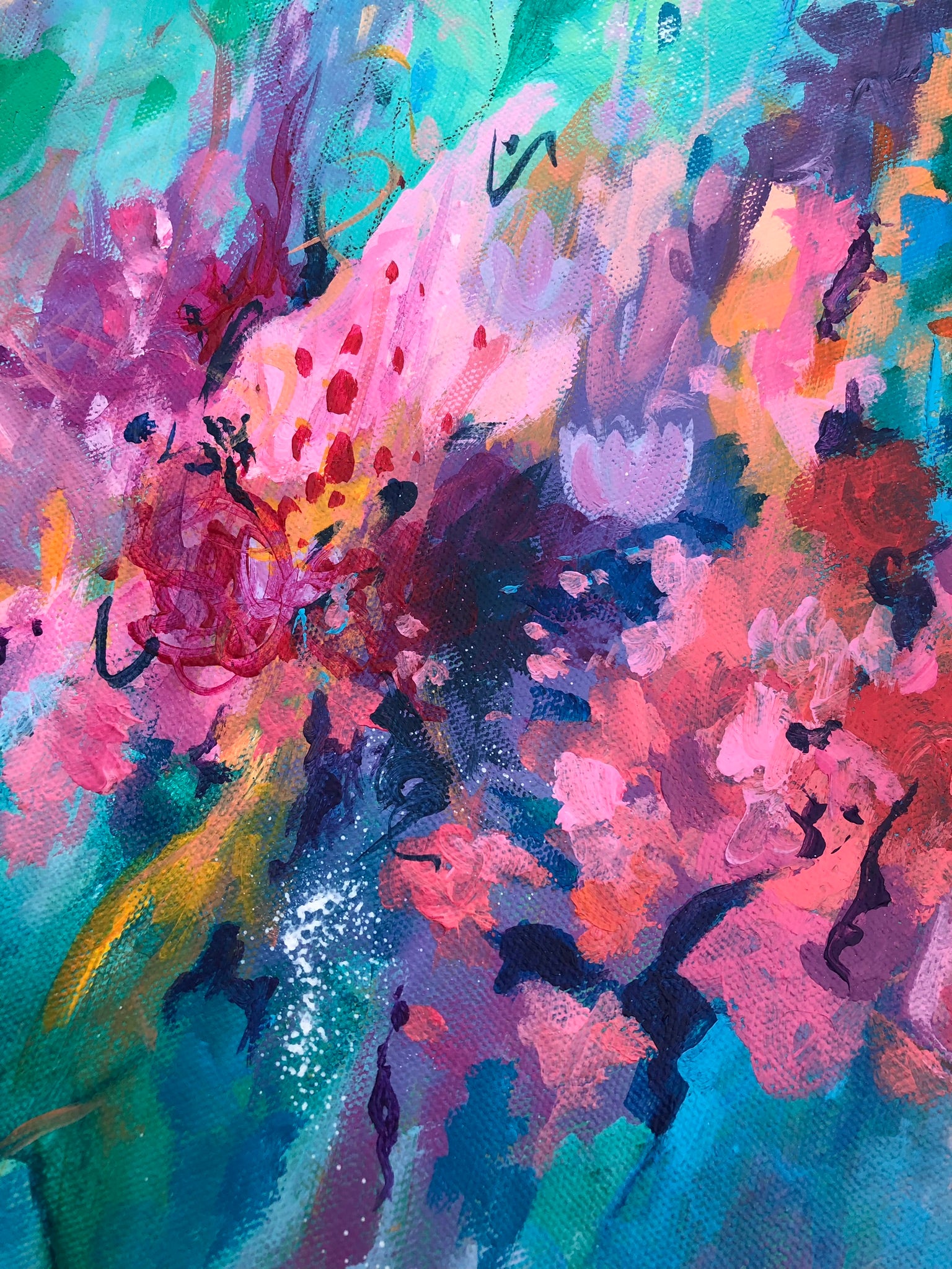 Close up details of vibrant painted pink and purple flowers