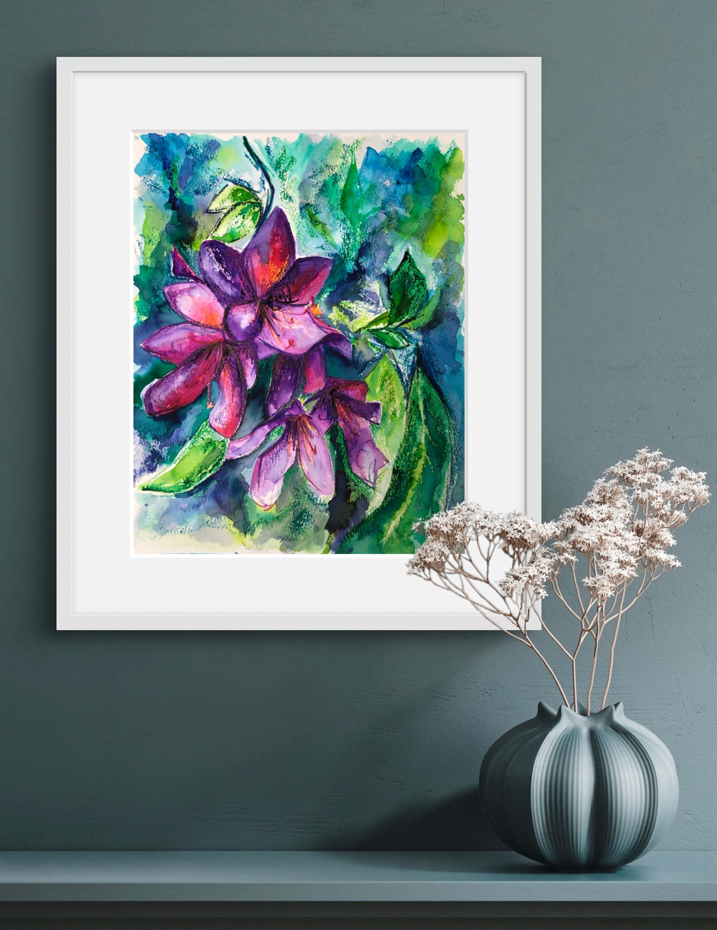 Rhodedendron original watercolour painting by Melanie Howells displayed in a white frame against a duck egg painted wall.