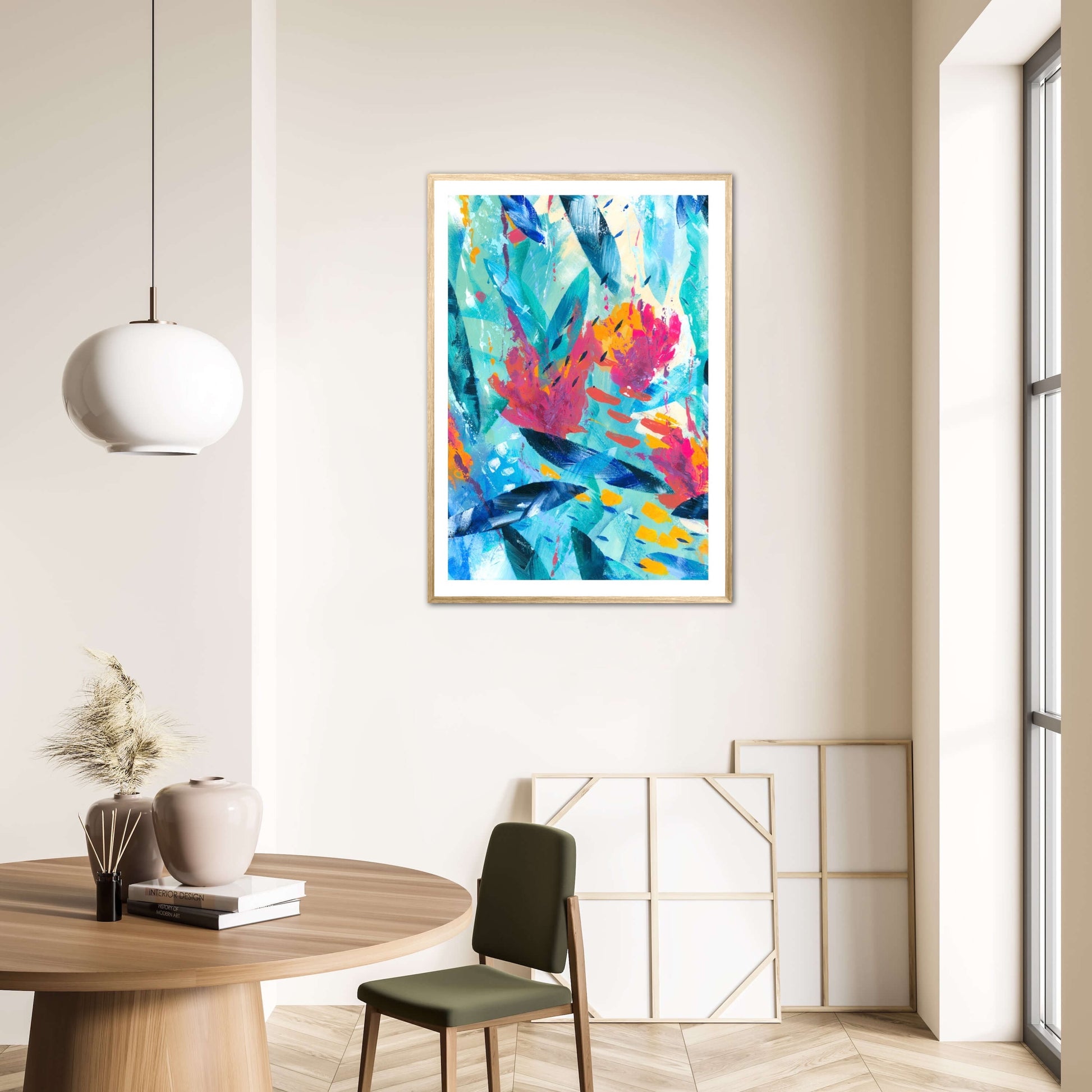 Tropical Seas colourful abstract art print displayed in a natural wood frame on a wall in a neutral interior decor.