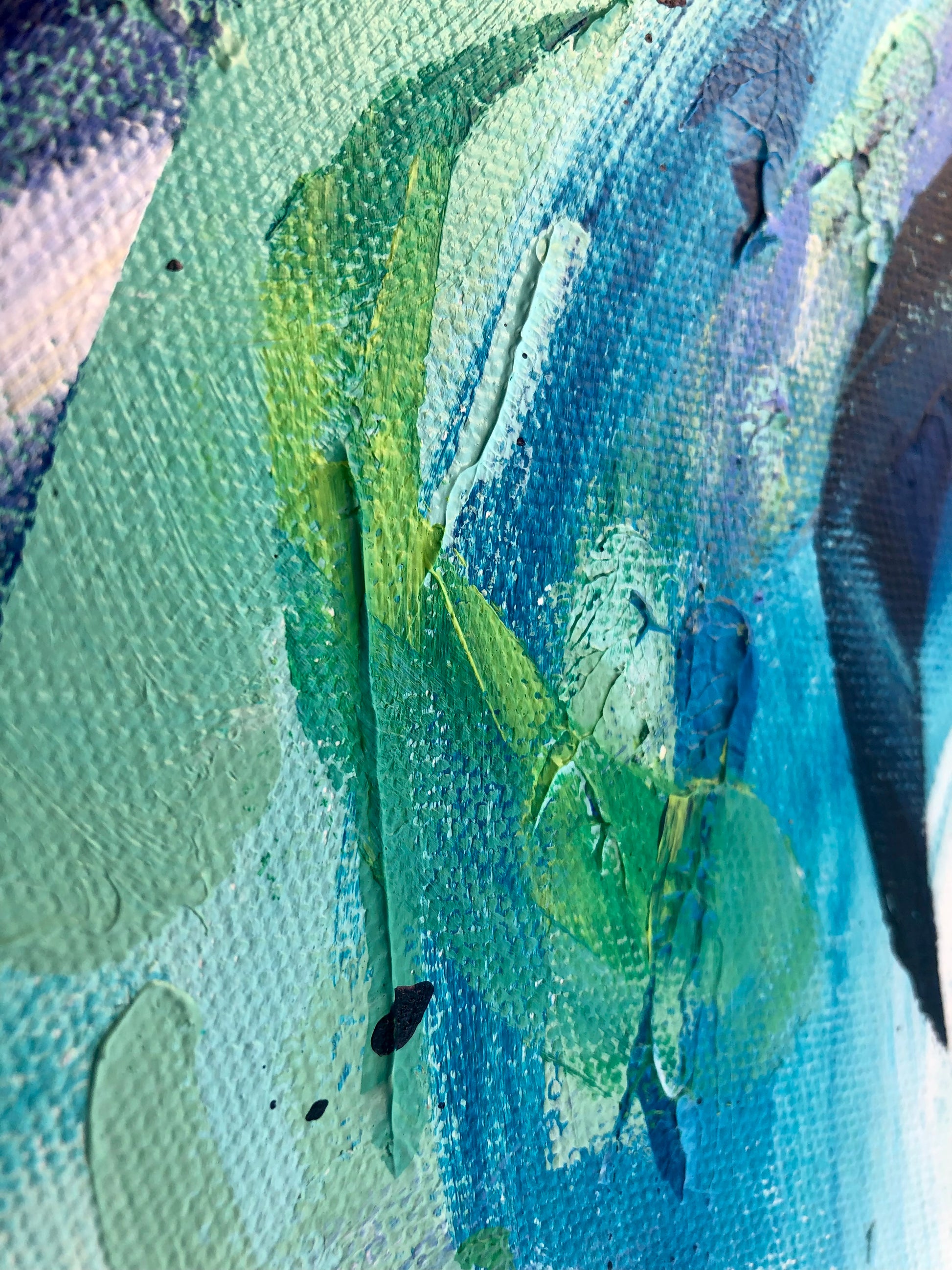 Close-up of painting details from an original acrylic painting in shades of blue and green