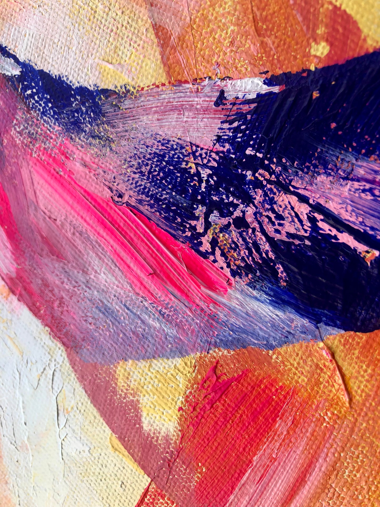 Close-up of painting details from an original acrylic painting in shades of pink, purple, yellow and orange