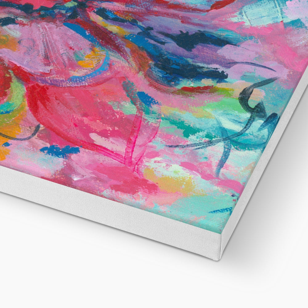 Abstract canvas wall art featuring a vibrant mix of pink, blue, purple, green, and yellow brushstrokes, shown at an angle to highlight the wrapped canvas edge on a white background.