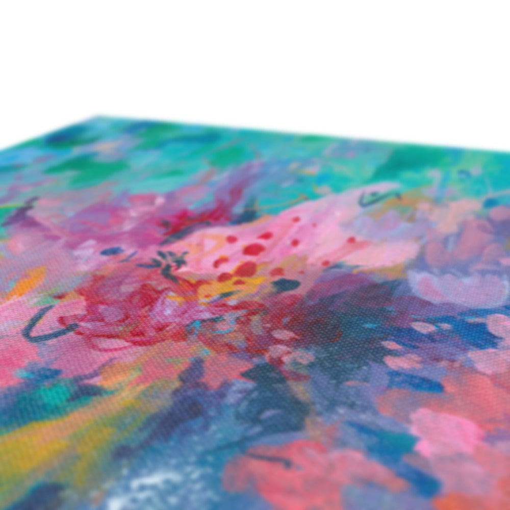 Close up detail of a colorful abstract painting with vibrant hues on a white background