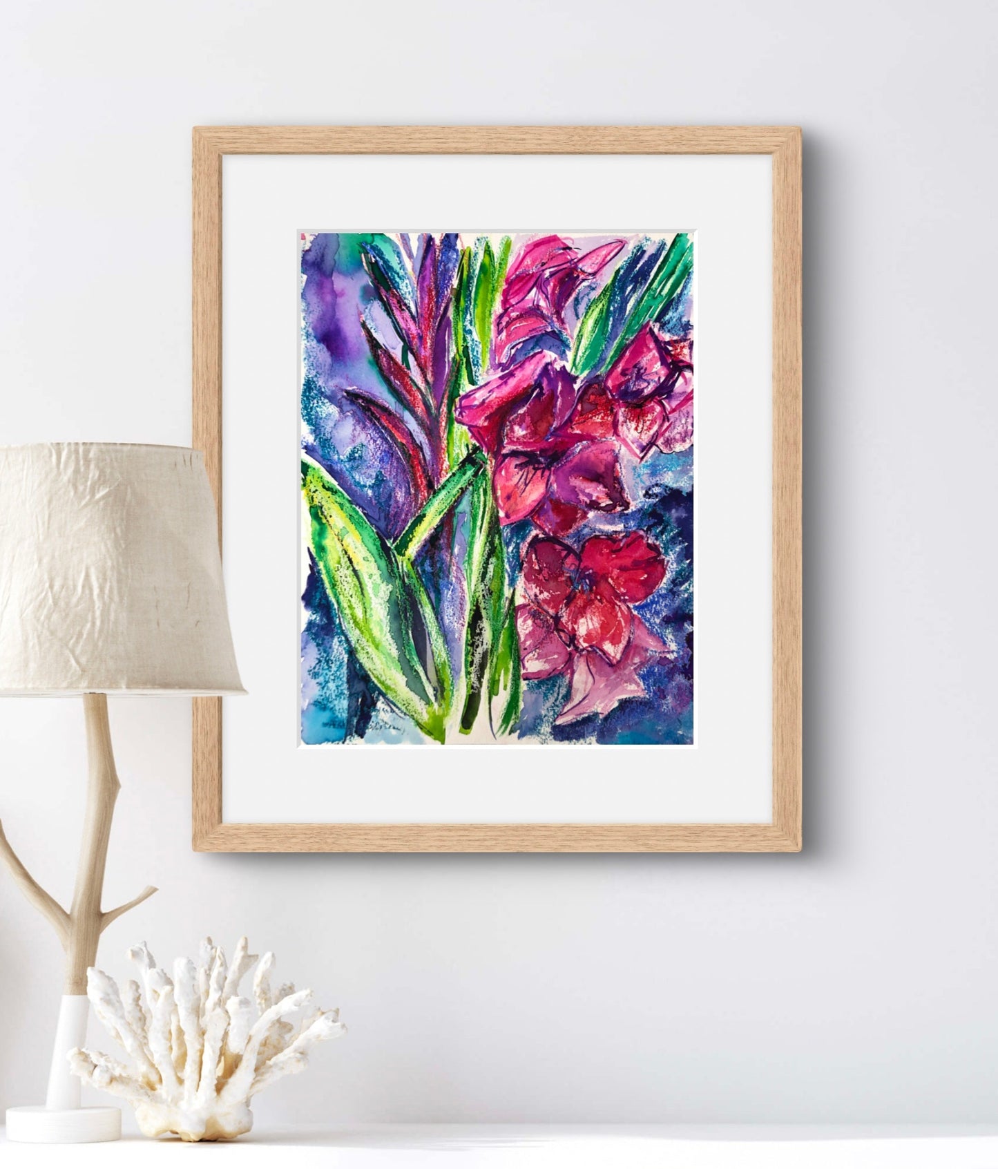 Gladioli floral painting wth a white mount and displayed in a natural wood frame.