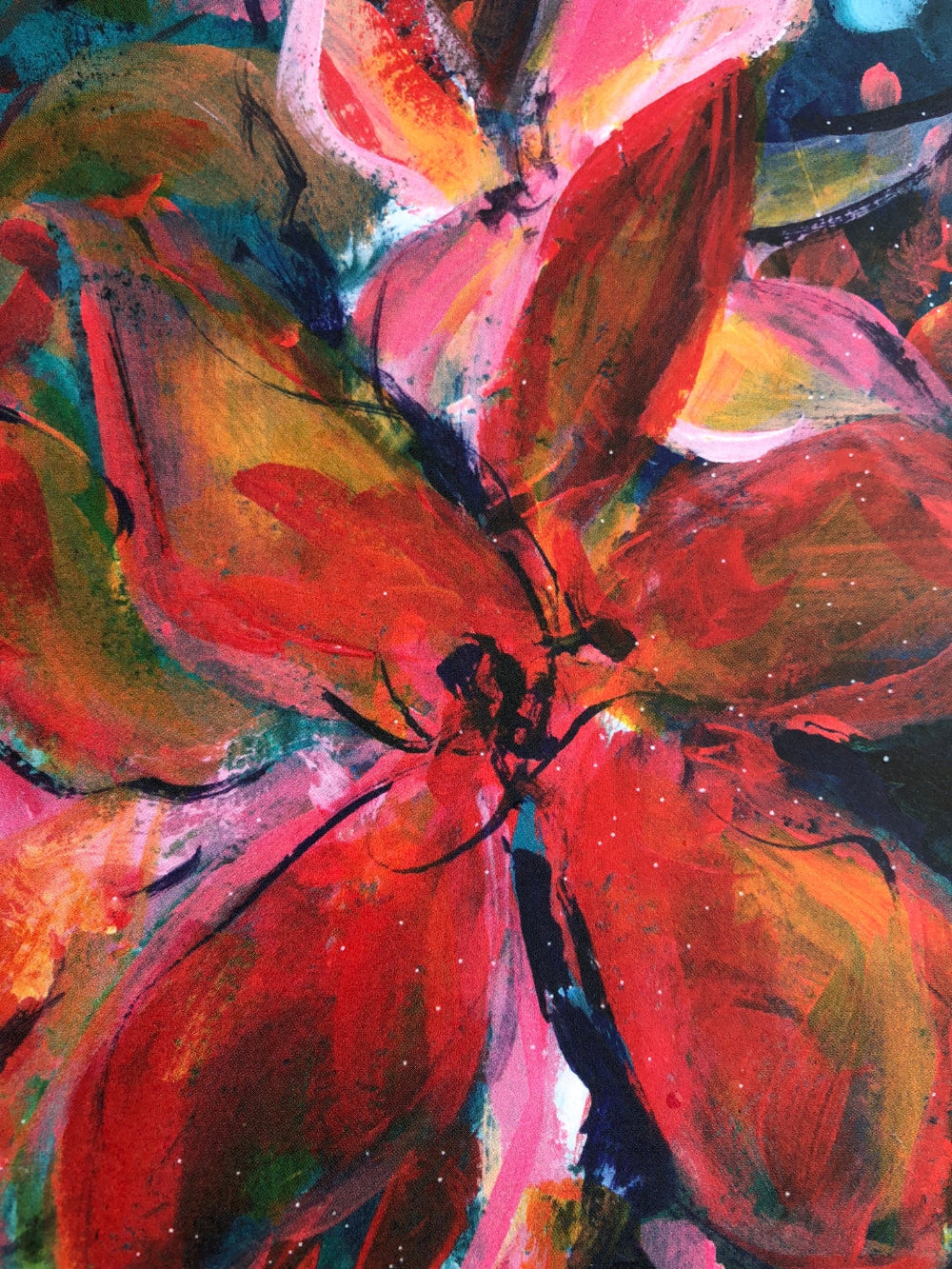 Close up detail taken from an abstract floral painting featuring bold brushstrokes in red, orange, pink, green, and black, with expressive petals and splattered paint details.