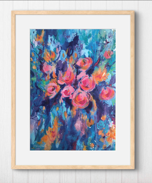Framed floral art print featuring an expressive painting of pink and orange roses with blue and purple brushstrokes, set in a light wood frame against a white paneled wall.