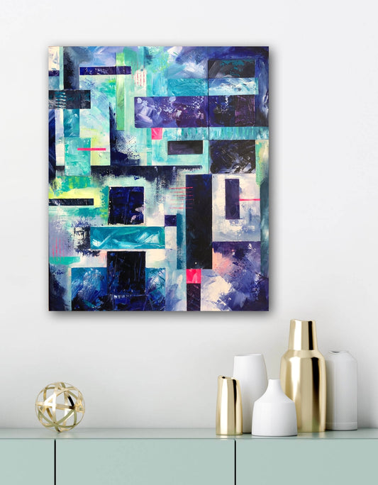 'Elemental' abstract geometric acrylic painting on canvas displayed on a white wall above an aqua coloured modern sideboard with gold and white vases on top.