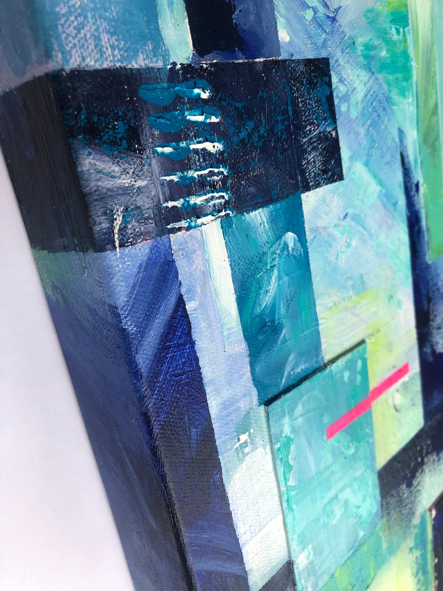 Close up detail of 'Elemental' abstract geometric painting on a deep canvas showing the painting wrapping around the sides of the canvas frame