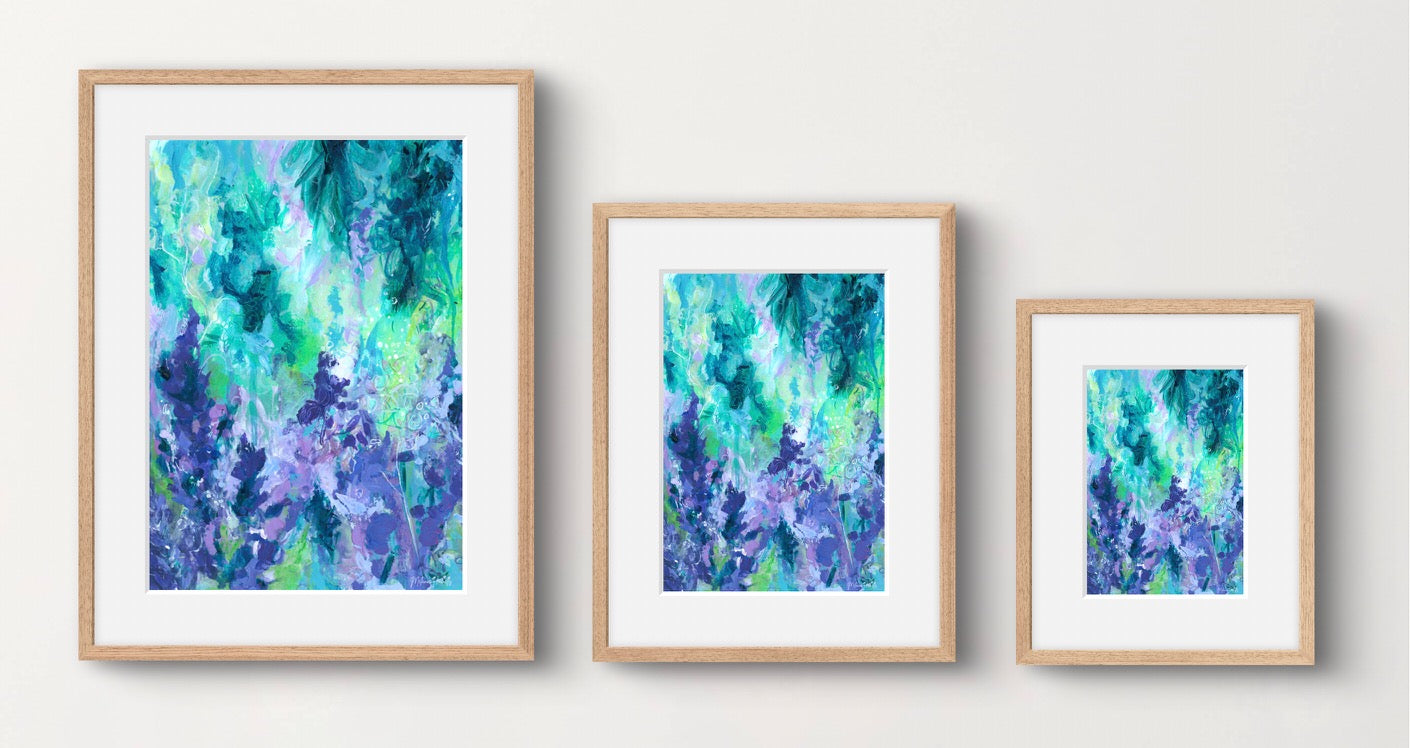 Three framed abstract artworks in different sizes on a white wall.