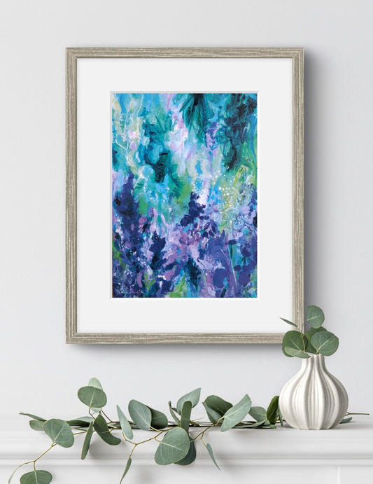 Framed abstract art print with eucalyptus and a vase on a white surface