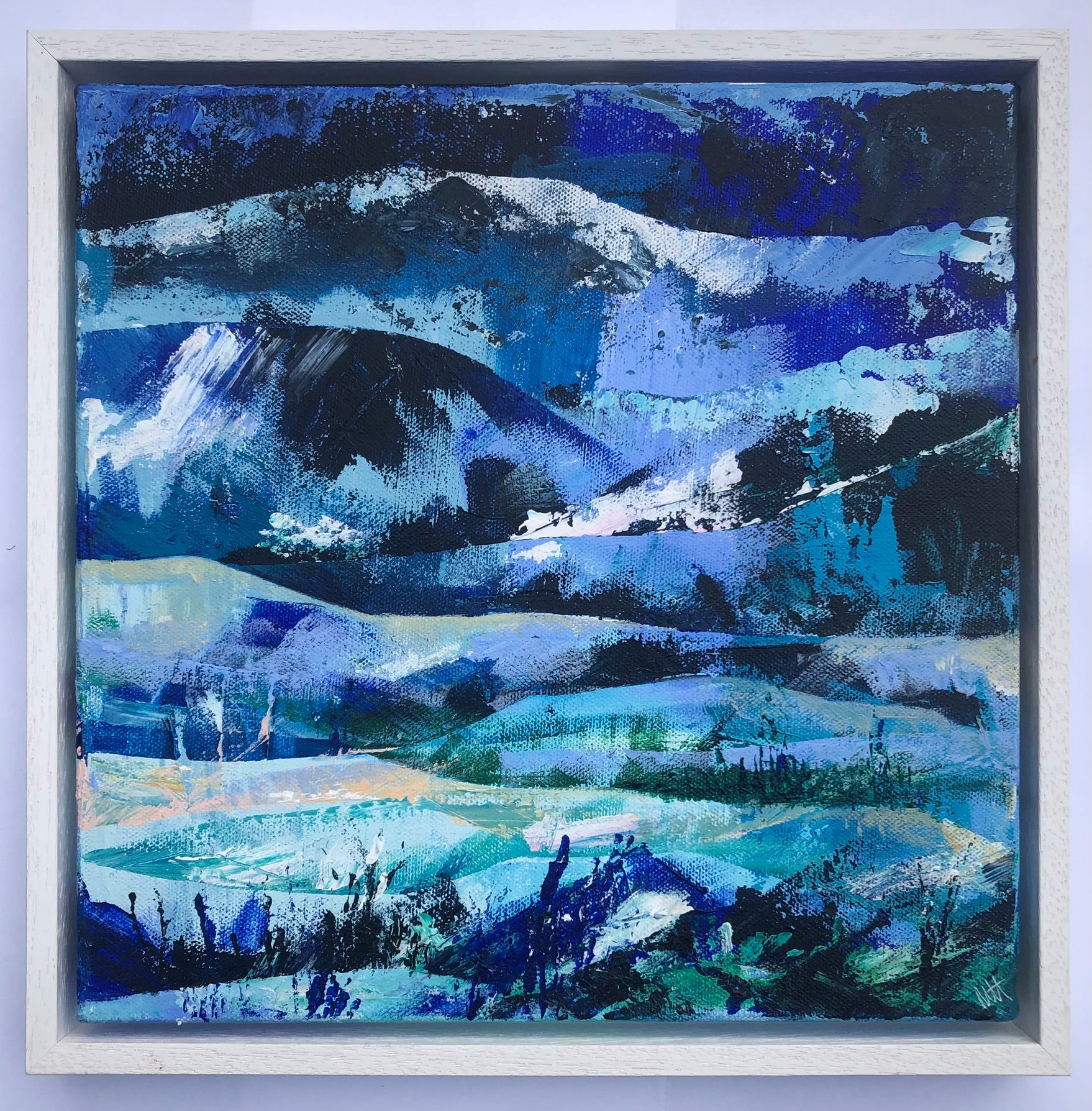 Blue abstract landscape painting of rolling hills and distant mountains