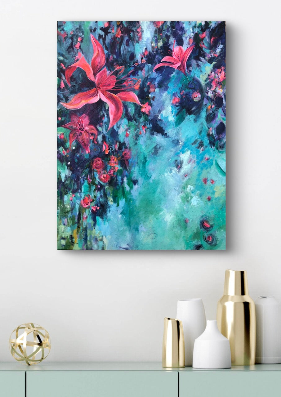 Colorful floral painting on a wall above a shelf with decorative items.