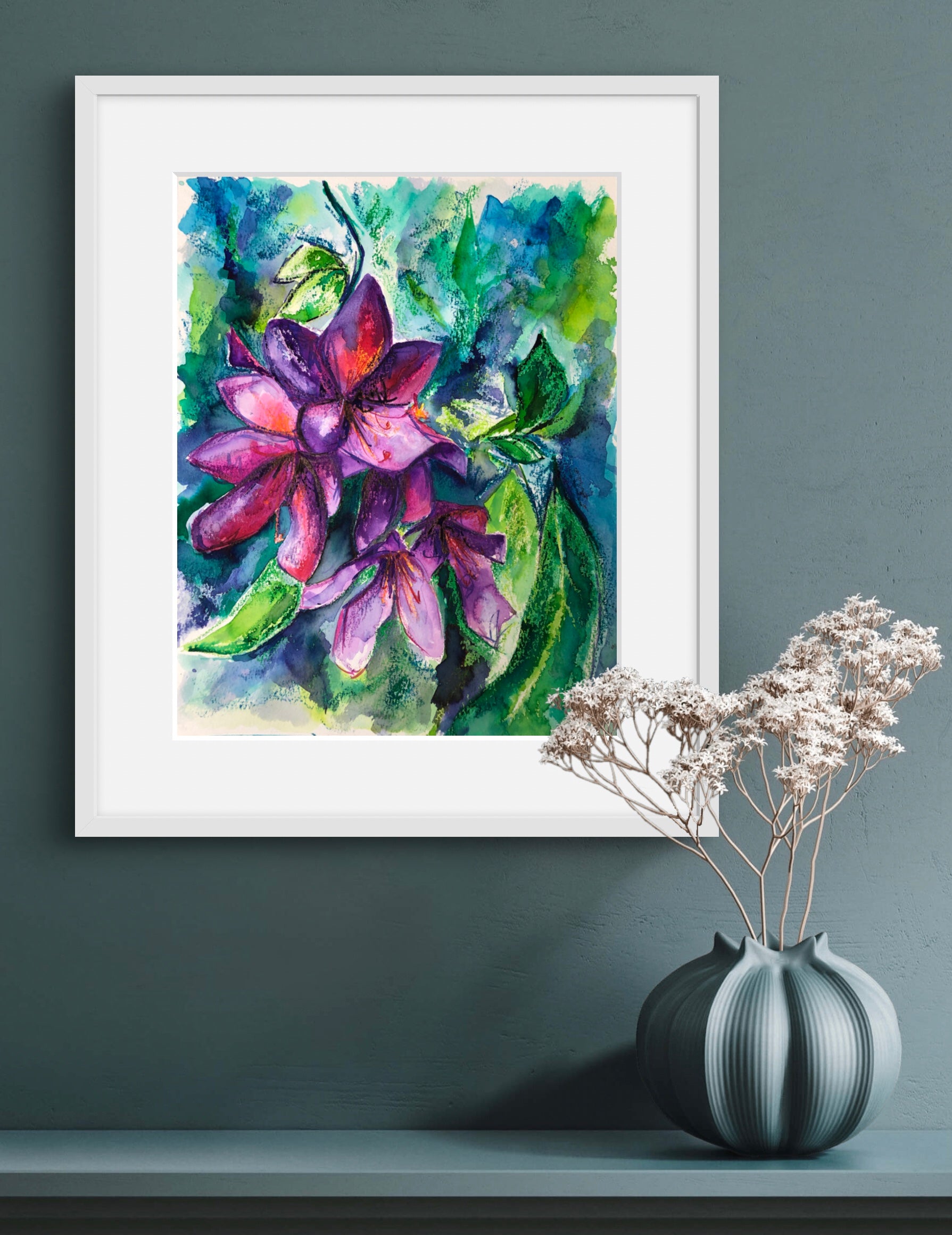 Rhodedendron original watercolour painting by Melanie Howells displayed in a white frame against a duck egg painted wall.