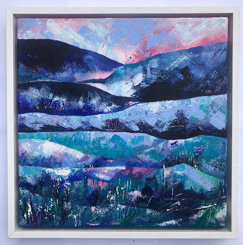 Abstract landscape painting of rolling blue hills against a pink sky