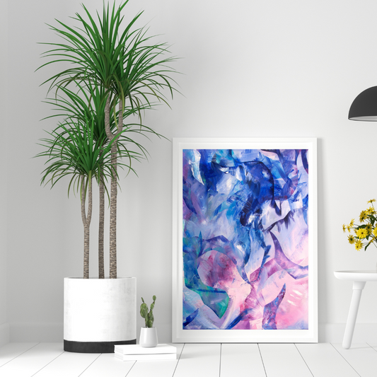 Exploration blue, pink and purple abstract art print displayed in a white frame in a contemporary white interior.