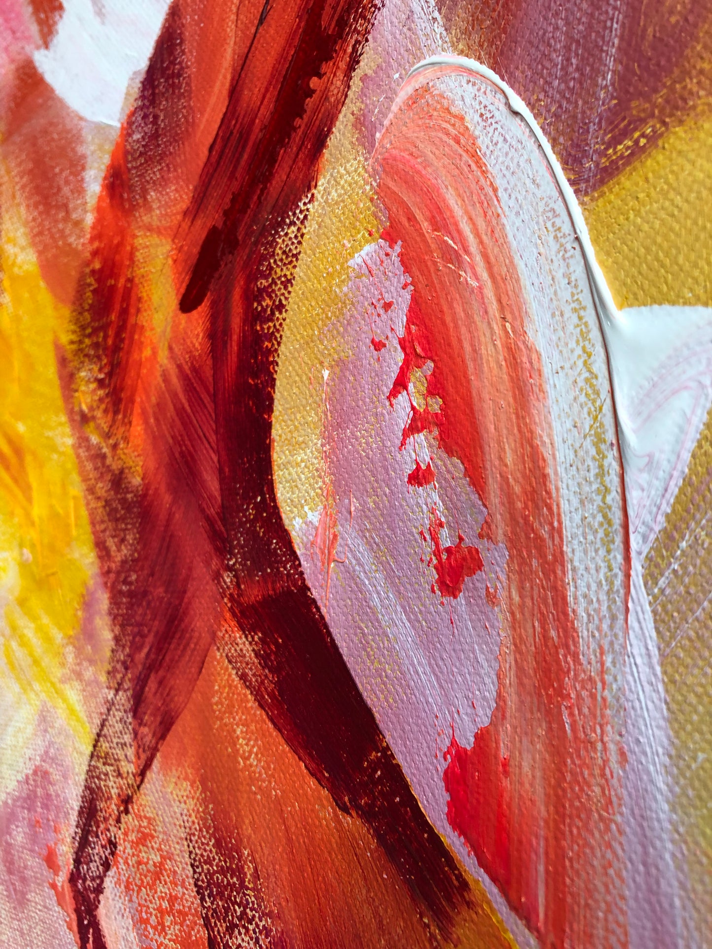 Close-up of painting details from an original acrylic painting in shades red, orange, yellow and white