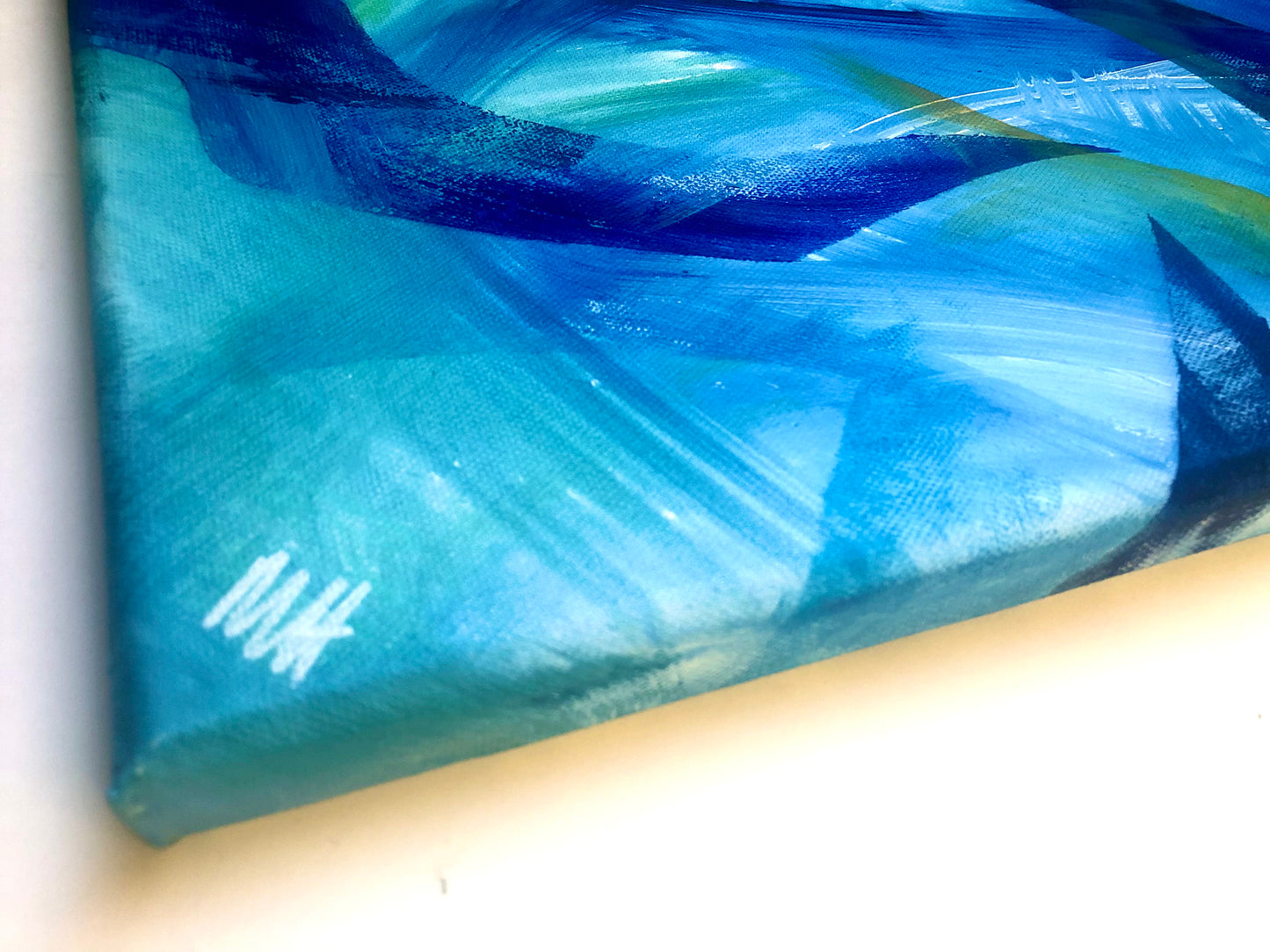 Painted side of canvas with artist's signature from original painting Equilibrium, in shades of blue and green