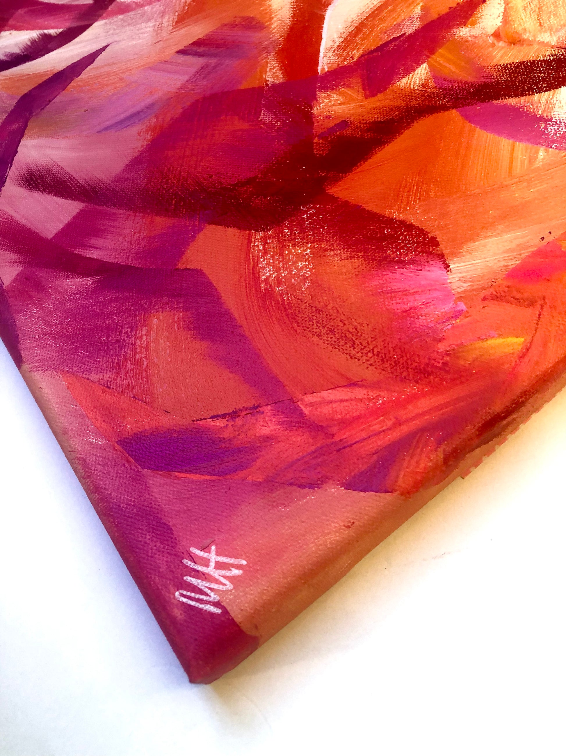 Painted side of canvas with artist's signature from original painting Passion in shades of red, pink and orange