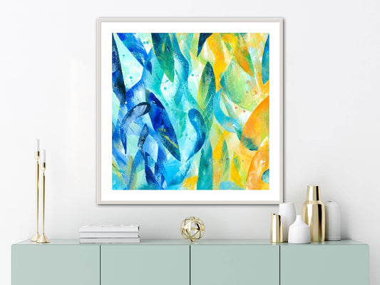 Synergy art print displayed in a white frame on the wall of a contemporary room above a modern sideboard