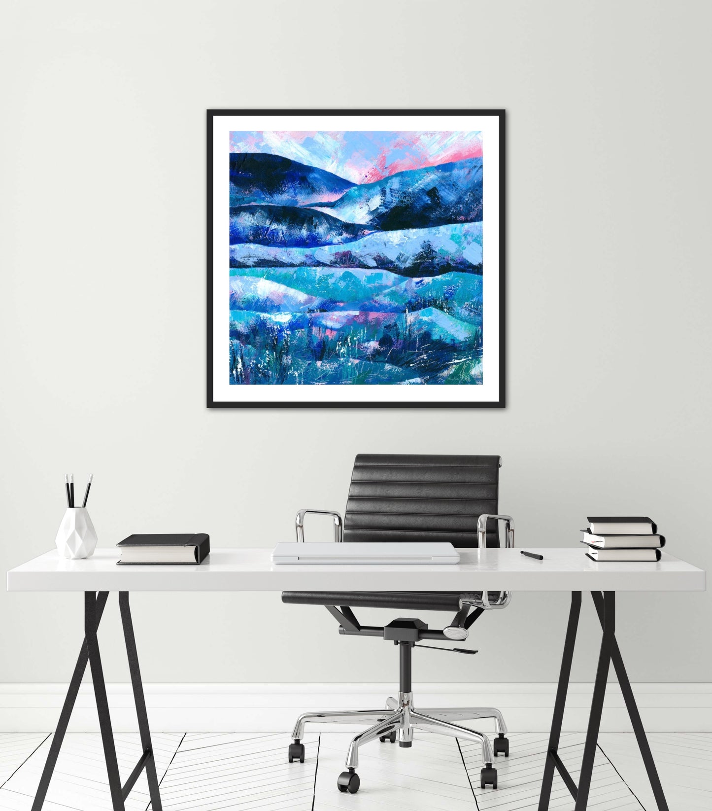 Tranquility abstract landscape painting fine art print displayed in a black frame on a white wall above a desk in a minimalist white office