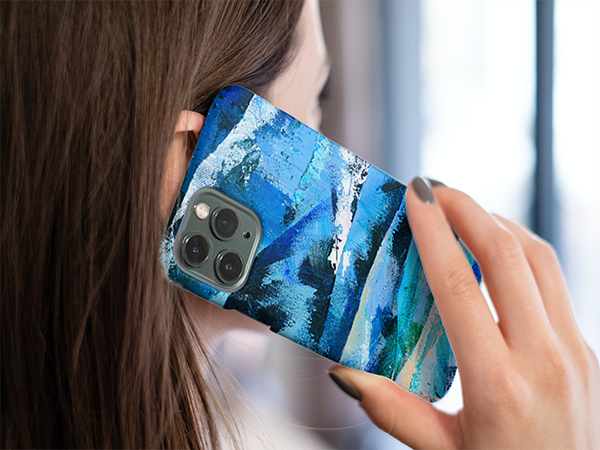 Woman holding to her ear an i phone with Into the Blue abstract art phone case