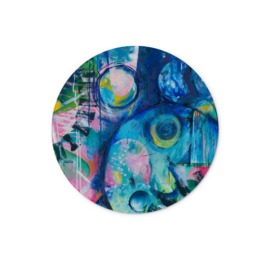 Round, circular glass chopping board with modern, colourful abstract art design
